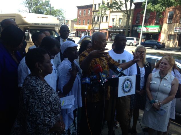 Assemblyman CHarles Barron, center, with Victor Dempsey and other legislators today.