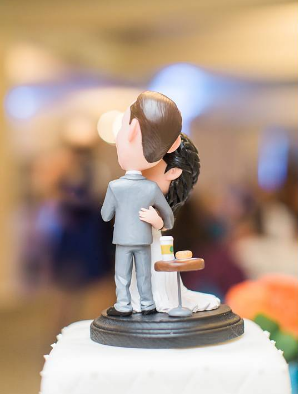 A coffee meets bagel wedding cake topper for a couple who met on the app. 
