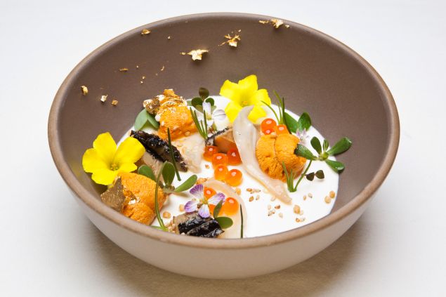 The Ugly Bunch, one of Providence's most famous dishes, is a symphony of abalone, geoduck, sea urchin and smoked creme fraiche panna cotta adorned with edible flowers from the restaurant's roof garden.