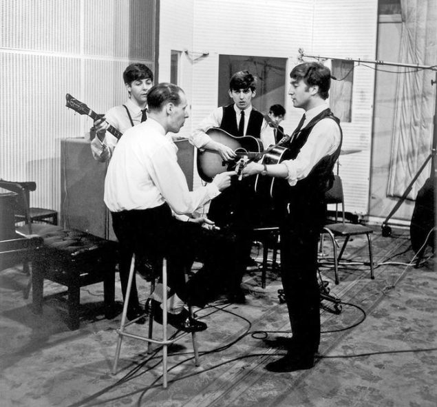 The Beatles with producer George Martin in 1966.