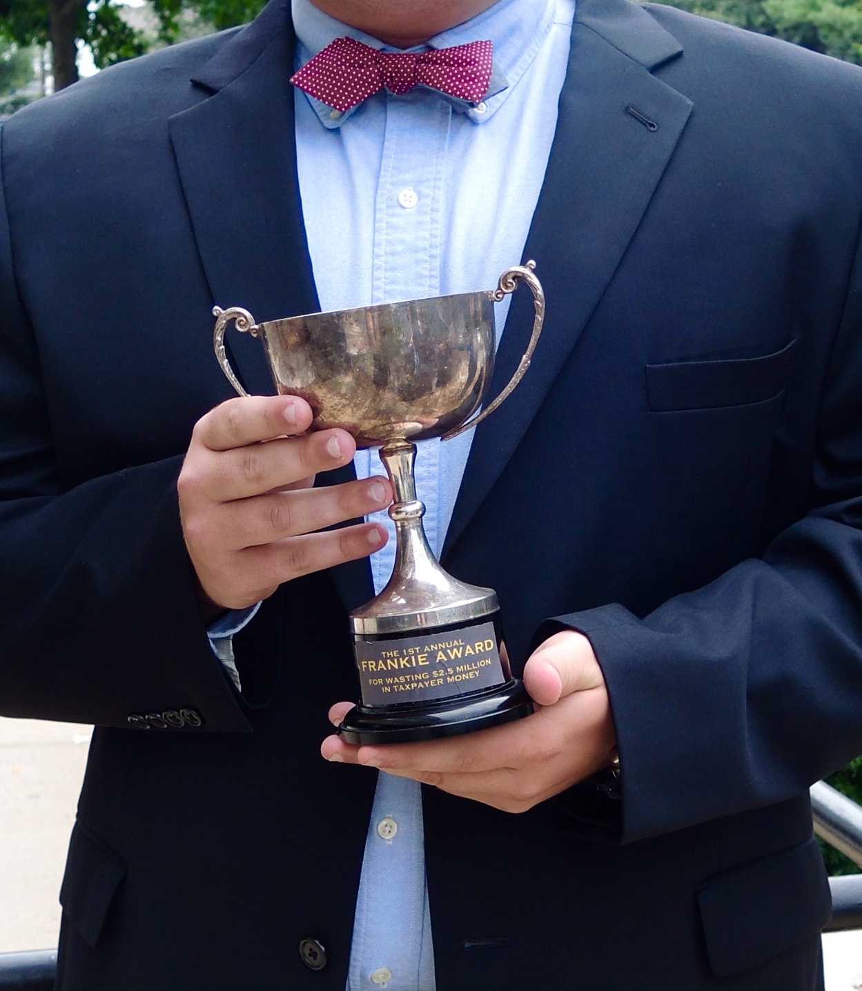 A Gottheimer volunteer holds the "Frankie Award" presented to Garrett.