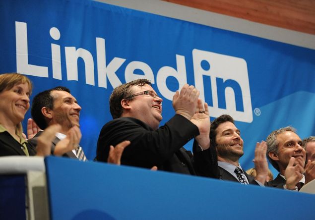 Linkedin founder Reid Garrett Hoffman (C) and CEO Jeff Weiner (2nd R) at the ringing of the opening bell of the New York Stock Exchange May 19, 2011 during the initial public offering of the company. AFP PHOTO/Stan HONDA