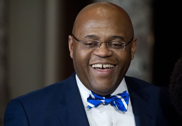 US Senator William "Mo" Cowan smiles after being sworn-in as the new US Democratic Senator from Massachusetts at the US Capitol in Washington, DC, on February 7, 2013. 