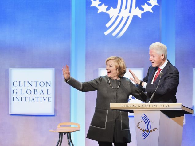 Hillary Clinton and husband, Former U.S. President Bill Clinton address the audience during the Opening Plenary Session: Reimagining Impact for the Clinton Global Initiative on September 22, 2014. 