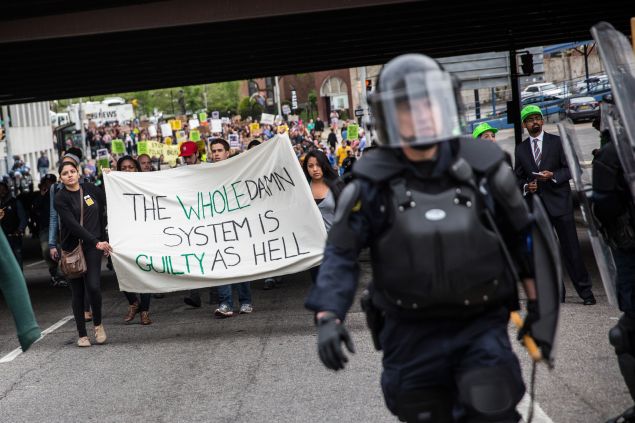 Protesters march through the streets in support of Maryland state attorney Marilyn Mosby's announcement that charges would be filed against Baltimore police officers in the death of Freddie Gray on May 1, 2015 in Baltimore, Maryland.