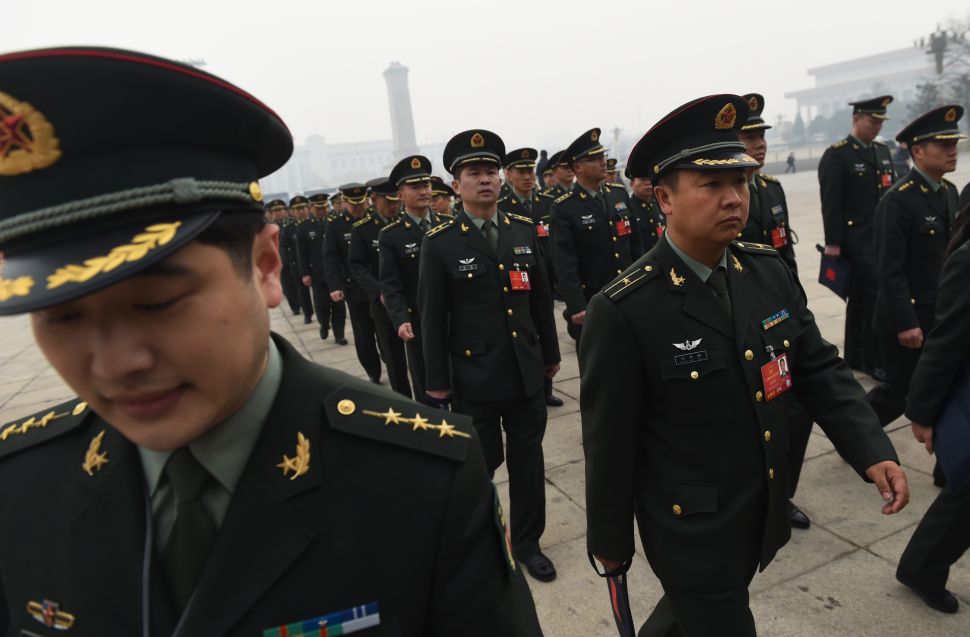 Military delegates arrive for a session of the Chinese People's Political Consultative Conference (CPPCC) in Beijing on March 4