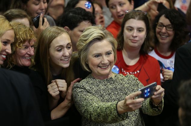 INDIANAPOLIS, IN - MAY 01: Democratic presidential candidate Hillary Clinton takes cell phone photographs with people during a campaign stop 