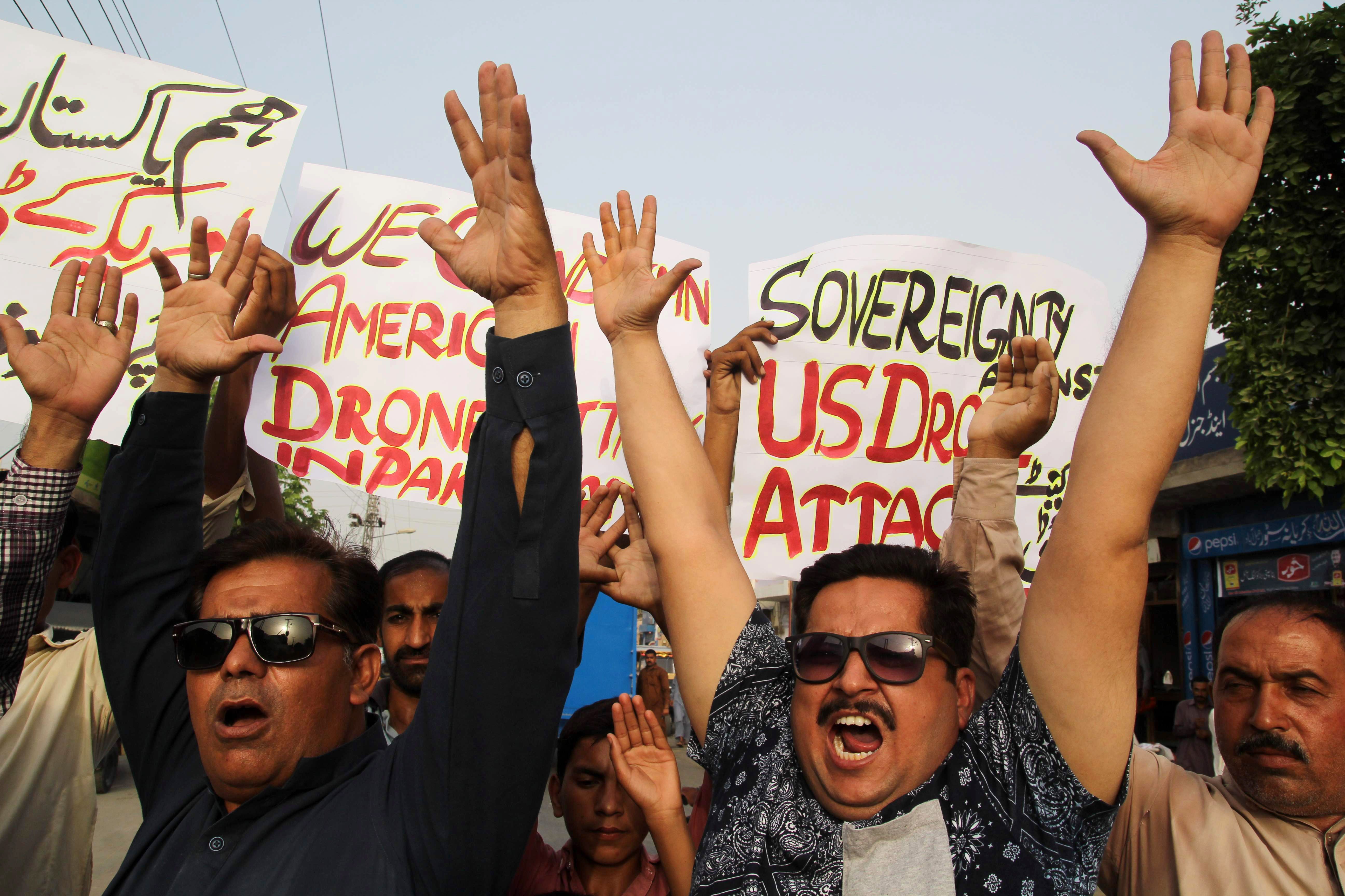 Pakistani civil society activists shout slogans during a demonstration in Multan on May 23, 2016, against a US drone strike in Pakistan's southwestern province of Balochistan.