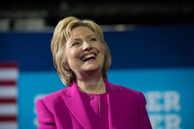 US Democratic presidential candidate Hillary Clinton laughs as President Barack Obama speaks at a campaign event for in Charlotte, North Caro., on July 5