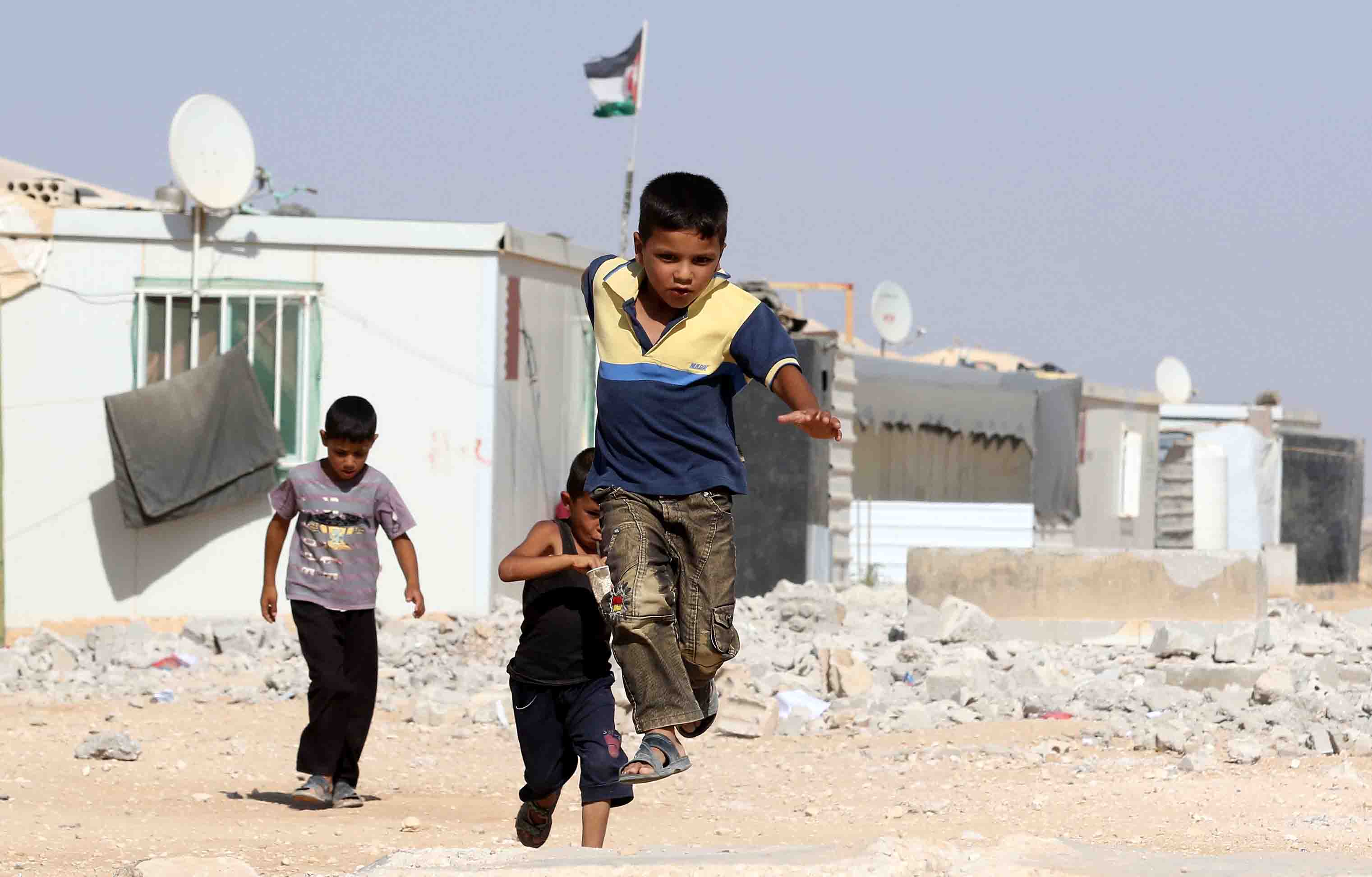 Syrian refugee boys play at the Zaatari refugee camp.