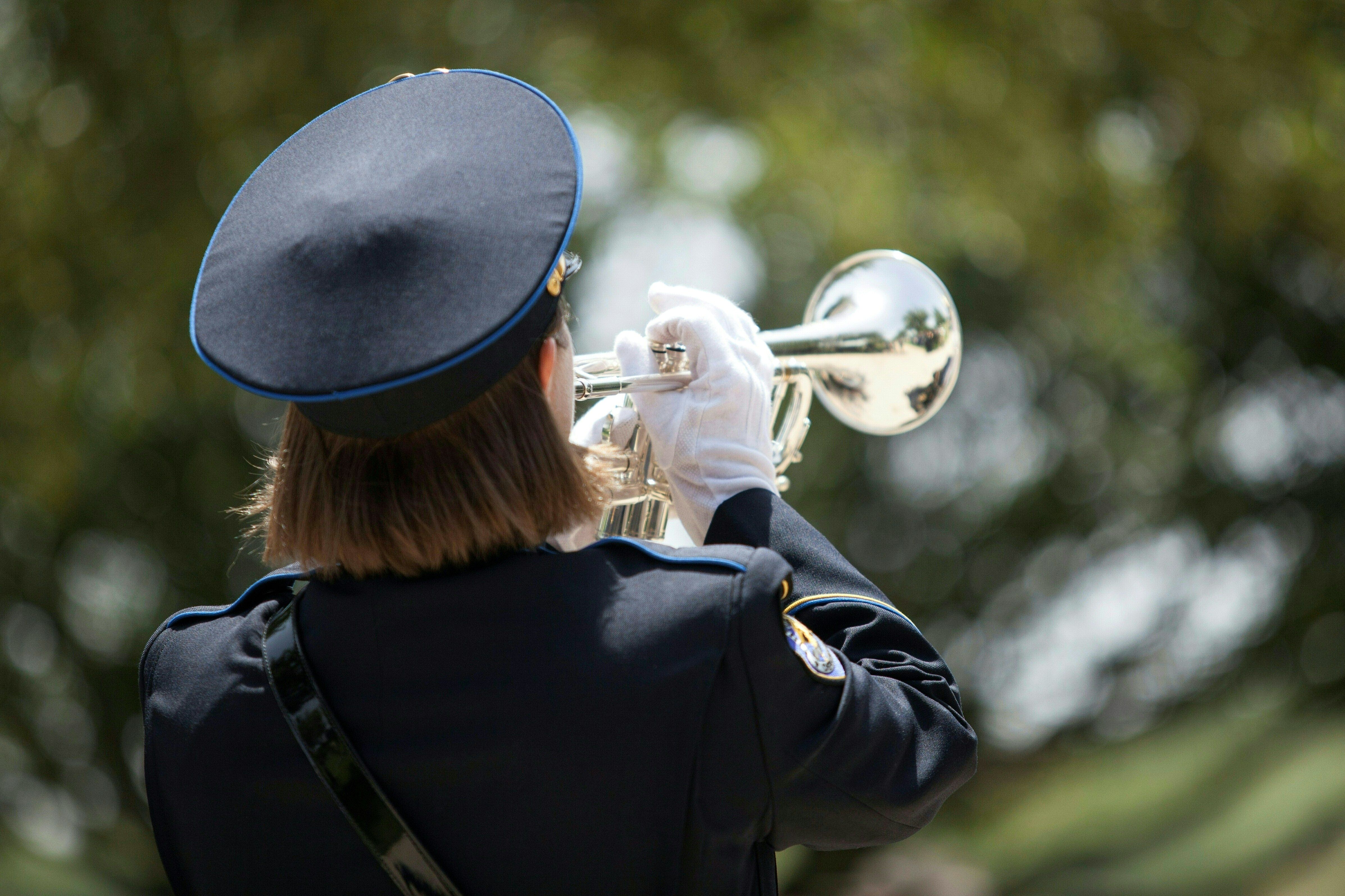 A trumpet player plays at the funeral procession for Dallas Police officer Patricio Zamarripa during his funeral at the Dallas Fort Worth National Cemetery on July 16, 2016.