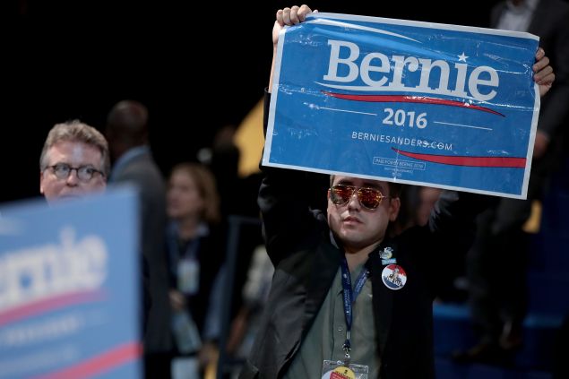 PHILADELPHIA, PA - JULY 25: An attendee holds a sign in support of Sen. Bernie Sanders on the first day of the Democratic National Convention