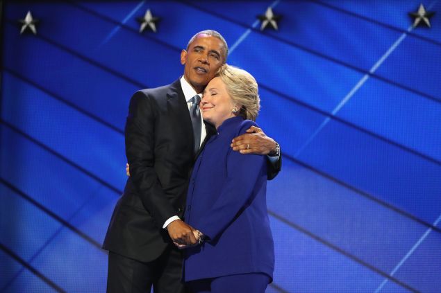 PHILADELPHIA, PA - JULY 27: President Barack Obama and Democratic presidential candidate Hillary Clinton embrace on the third day of the Democratic National Convention 