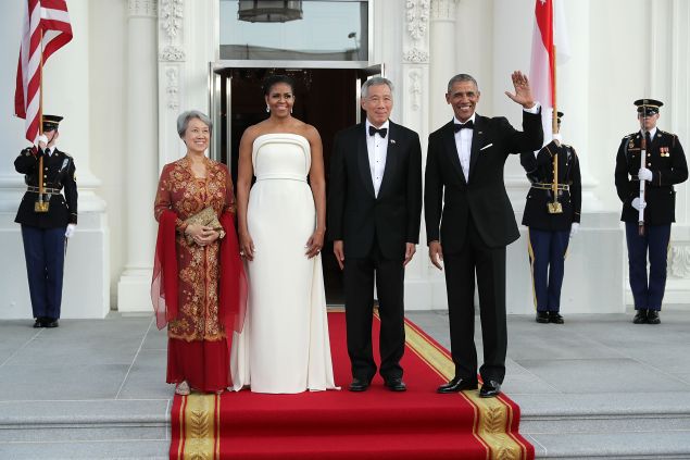 Ho Ching, first lady Michelle Obama, Prime Minister Lee Hsien Loong of Singapore and U.S. President Barack Obama pose for photographs in the North Portico of the White House August 2, 2016 in Washington, DC.