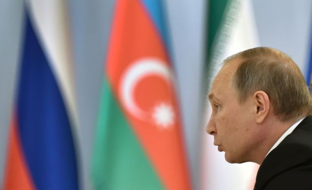 Russian President Vladimir Putin makes a speech during a meeting with his Azerbaijani counterpart Ilham Aliyev and Iranian leader Hassan Rouhani in Baku on August 8, 2016. The talks between Russian President Vladimir Putin, his Azerbaijani counterpart Ilham Aliyev and Iranian leader Hassan Rouhani are focused on the North-South Transport Corridor -- the ship, rail, and road route for freight between India, Russia, Iran, Europe and Central Asia -- and more generally on economy and trade as well as anti-terrorism cooperation. 