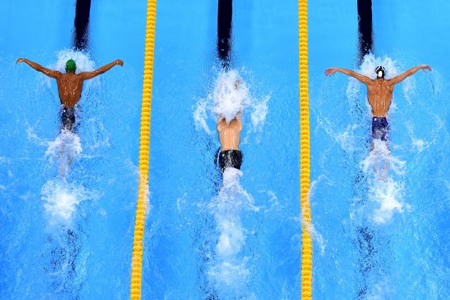 Chad le Clos, left, and Michael Phelps, right, in the close race