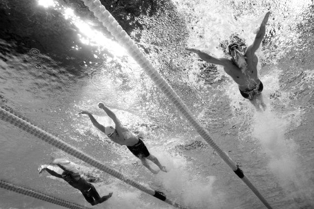 RIO DE JANEIRO, BRAZIL - AUGUST 08: (EDITORS NOTE: This image has been converted to black and white) Michael Phelps of the United States (R) competes in the second Semifinal of the Men's 200m Butterfly on Day 3 of the Rio 2016 Olympic Games at the Olympic Aquatics Stadium on August 8, 2016 in Rio de Janeiro, Brazil.