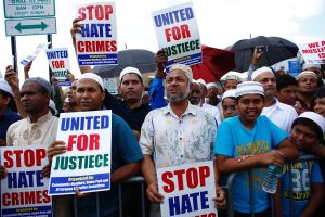 Community members gather during funeral prayers for Imam Maulama Akonjee, 55, and Thara Uddin, 64.