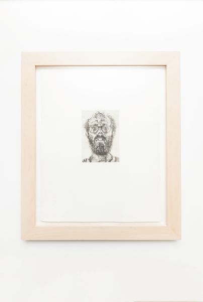 A Chuck Close painting, which was a gift from a client