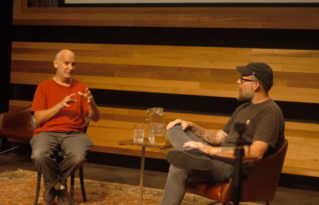 Ian MacKaye, left, with Brandon Stosuy, in Kickstarter's Greenpoint auditorium.