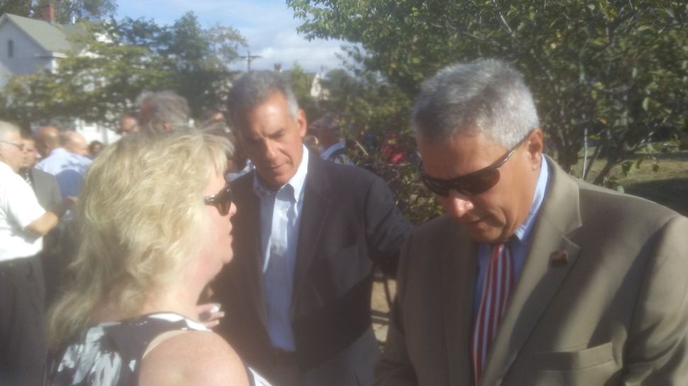 Assemblyman Jack Ciattarelli (R-Hillsborough), center, checks in with 16th District boss state Senator Kip Bateman, right, at Sunday's 911 memorial service in Somerville.