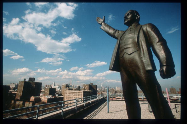 329566 35: A statue of Lenin stands on the roof of the Red Square Building in the East Village June 1, 1998 in New York City. Populated by residents of numerous heritages including Jewish, Chinese, Latino, African American and Greek, neighborhoods in New York''s Lower East Side are also home to many painters and artists, some of whom have been tempted to leave since the area''s renewed popularity has caused important rent increases.