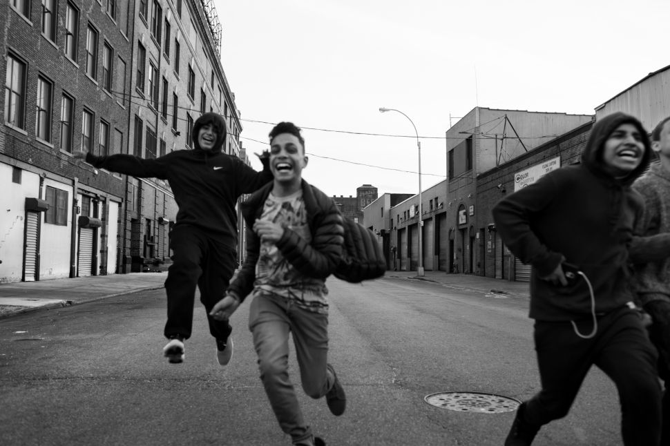 Juan Neira, Chavi Leon, Marco Vasquez and Edwin Amaro running on an afternoon free of school, 10 Apr 2016, Mott Haven, Bronx. All four boys attend different schools but live on the same block.