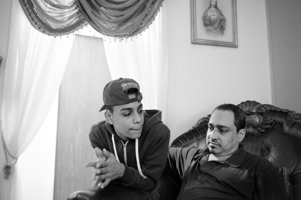 Chavier and his father Frank Leon inside of their apartment. Frank is one of Chavi's greatest supporters, pushing him to succeed and graduate high school.