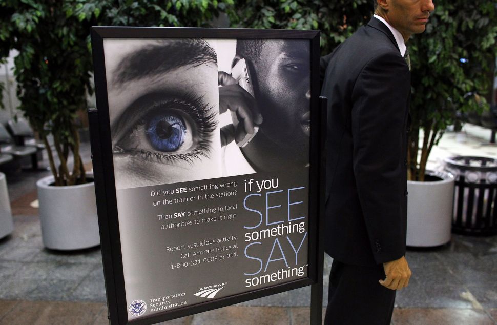 WASHINGTON - JULY 01: A member of Homeland Security Secretary Janet Napolitano's entourage stands at Union Station following her launch of the "See Something, Say Something" campaign and to announce a new national information-sharing partnership with Amtrak July 1, 2010 in Washington, DC. The "See Something, Say Something" campaign aims to engage riders in public security by reporting suspicous activity or items.