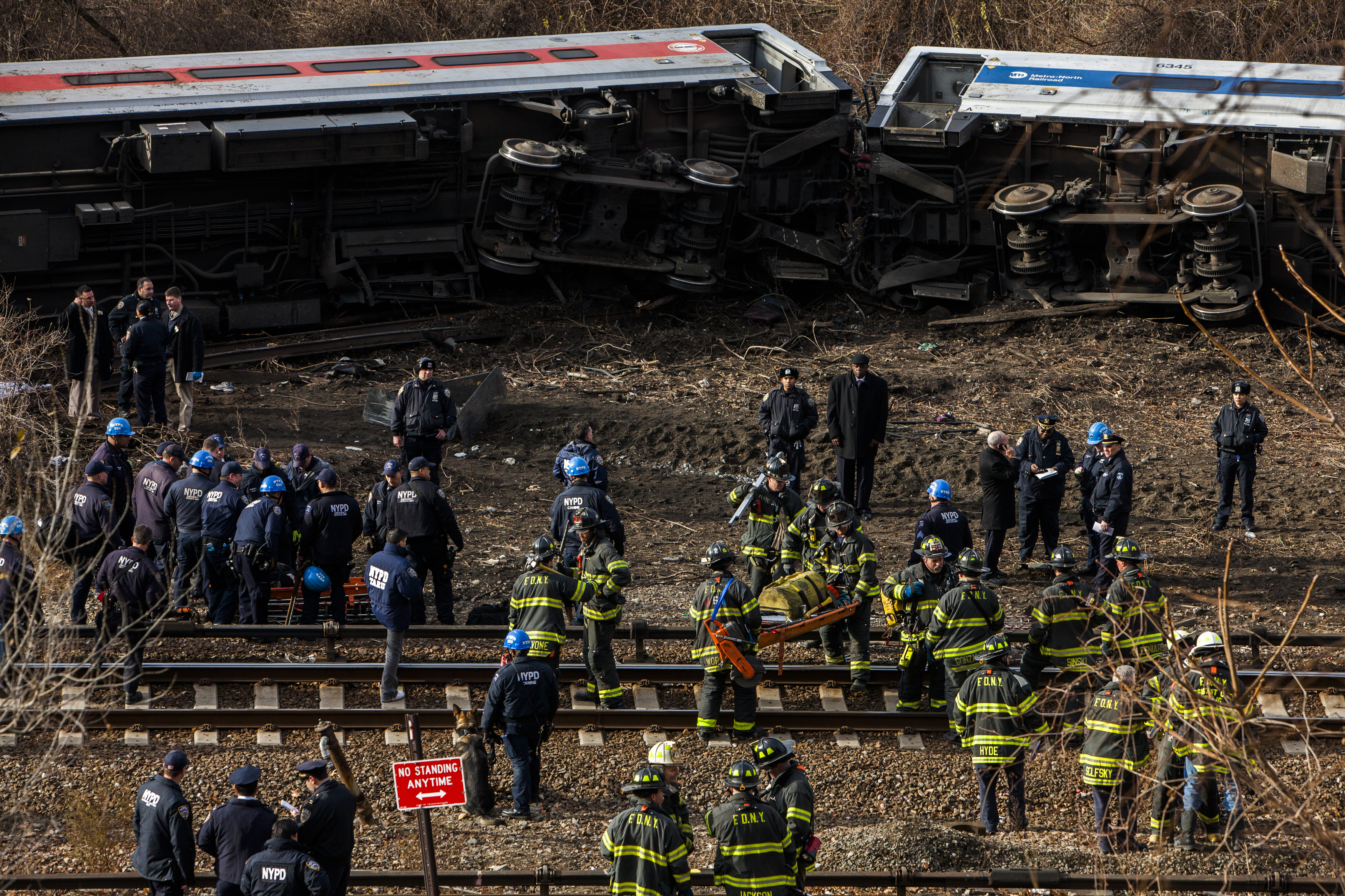 Police, firefighters and federal investigators at the site of the Metro-North derailment in New York, 2013.