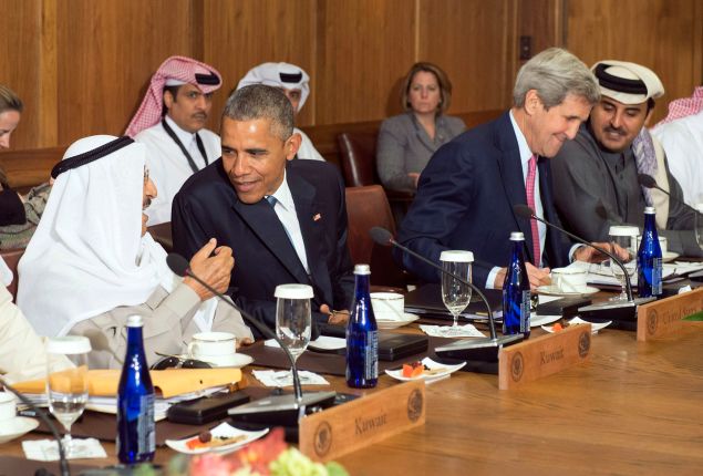 CAMP DAVID, MD - MAY 14: U.S. President Barack Obama talks to Sheikh Sabah Al-Ahmed Al-Jaber Al-Sabah, Amir of the State of Kuwait, while Secretary of State John Kerry talks to Sheikh Tameem Bin Hamad Al-Thani, Amir of the State of Qatar during a working lunch at the Gulf Cooperation Council-U.S. summit on May 14, 2015 at Camp David, Maryland.