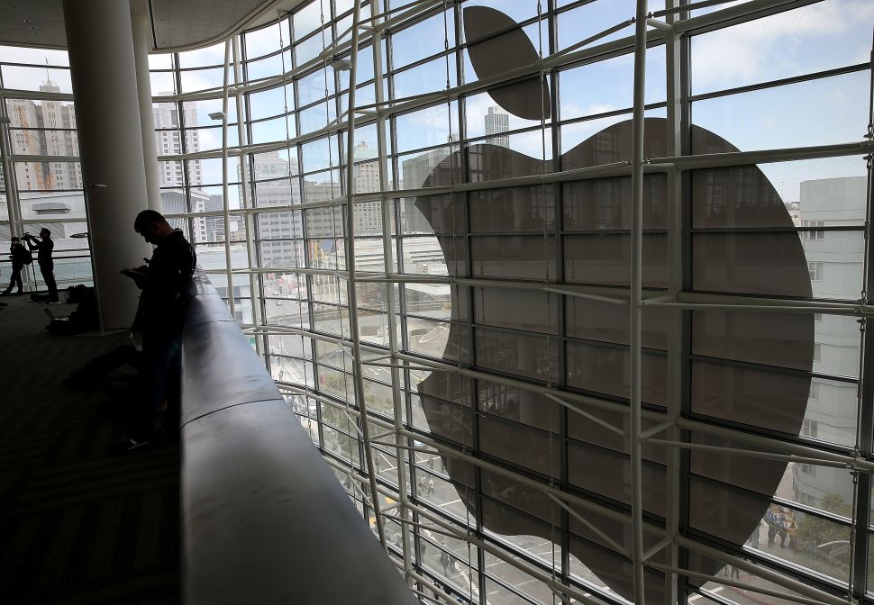 Attendees gather at the Apple Worldwide Developers Conference at the Moscone West center on June 2, 2014 in San Francisco, California. Apple CEO Tim Cook kicked off the annual WWDC which is typically a showcase for upcoming updates to Apple hardware and software. The conference runs through June 6.