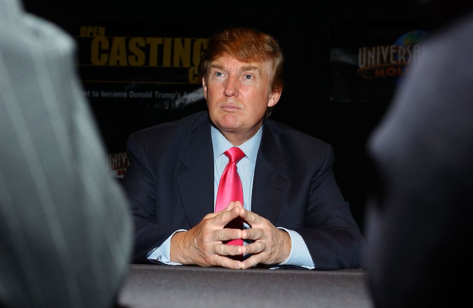 Businessman Donald Trump listens as potential contestants discuss their opinions on the first stop of the 16 city 'The Apprentice' Recruiting Tour on July 9, 2004 at Universal Studios Hollywood in Universal City, California.