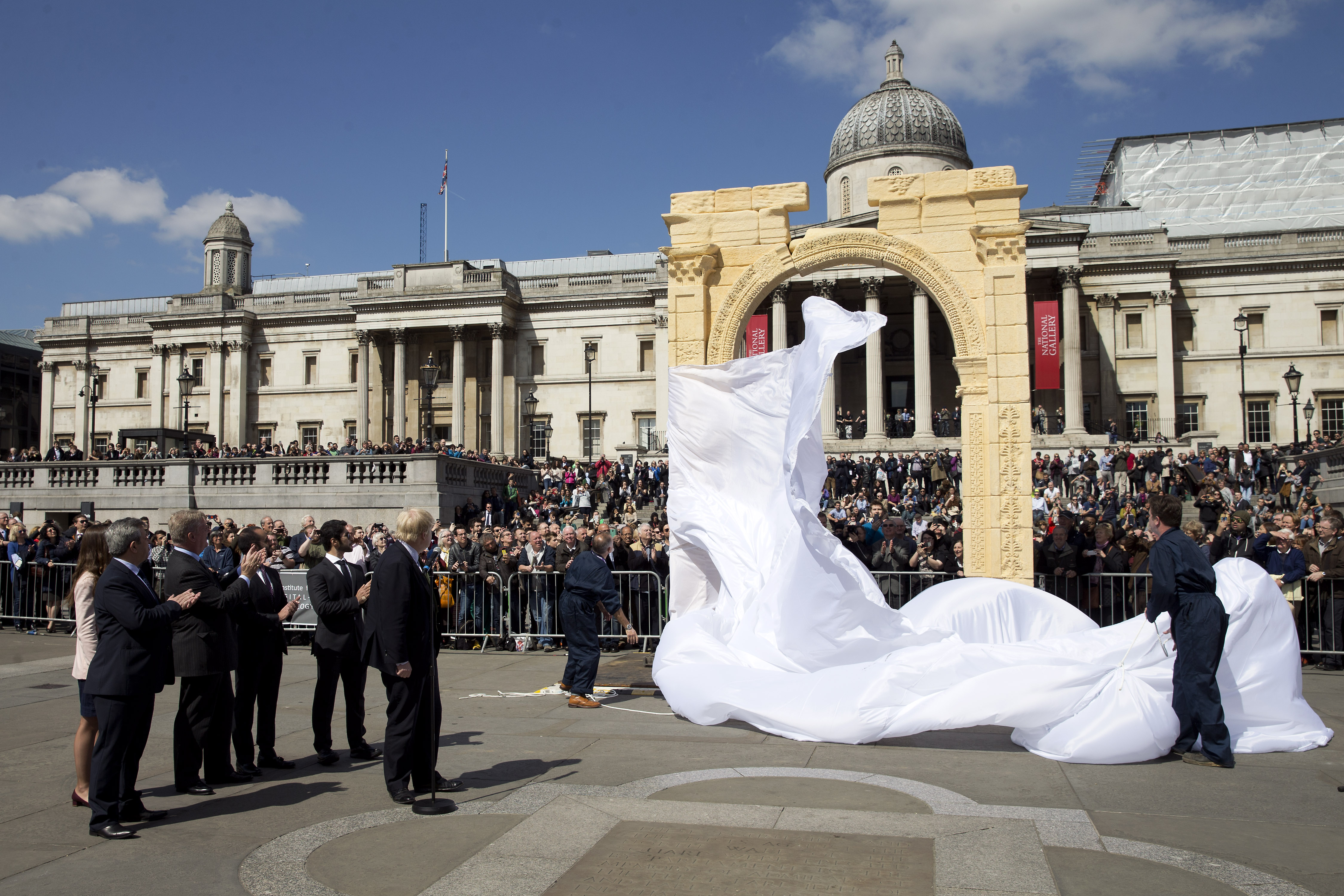 Mayor of London Boris Johnson (L) watches during the unveiling of a replica of Palmyra's Arch of Triumph in Trafalgar Square, central London, on April 19, 2016. The original arch was destroyed by the Islamic State (IS) and the replica has been crafted using the latest 3D printing and carving technologies by the Institute for Digital Archaeology.