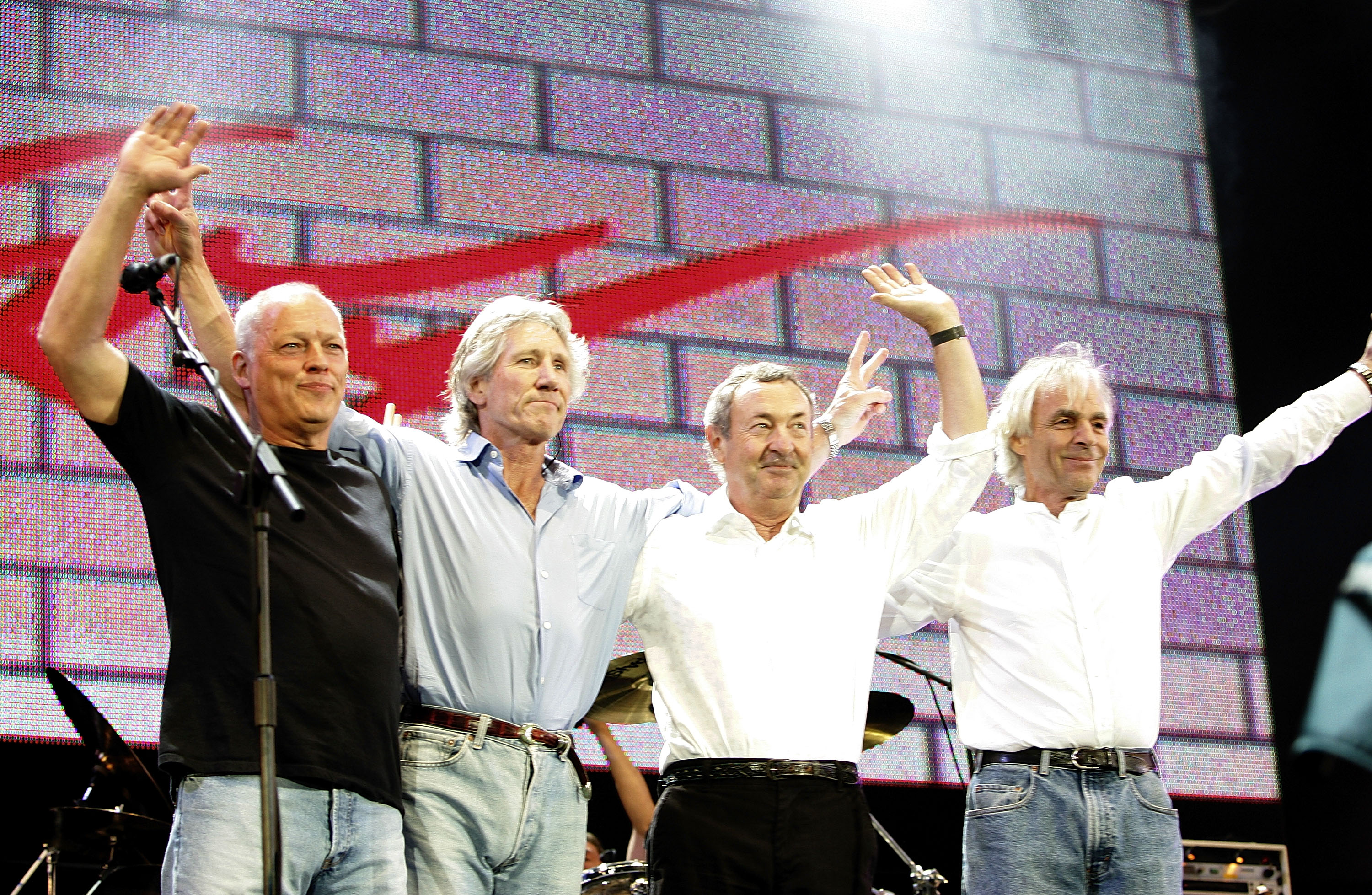 LONDON - JULY 02: (L to R) David Gilmour, Roger Waters, Nick Mason and Rick Wright from the band Pink Floyd on stage at "Live 8 London" in Hyde Park on July 2, 2005 in London, England. The free concert is one of ten simultaneous international gigs including Philadelphia, Berlin, Rome, Paris, Barrie, Tokyo, Cornwall, Moscow and Johannesburg. The concerts precede the G8 summit (July 6-8) to raising awareness for MAKEpovertyHISTORY.