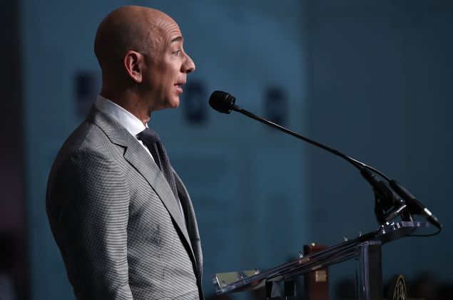 Amazon Founder and Washington Post owner Jeff Bezos delivers remarks during a naturalization ceremony on the 100th anniversary of Flag Day at the Smithsonian's National Museum of American History June 14, 2016 in Washington, DC.