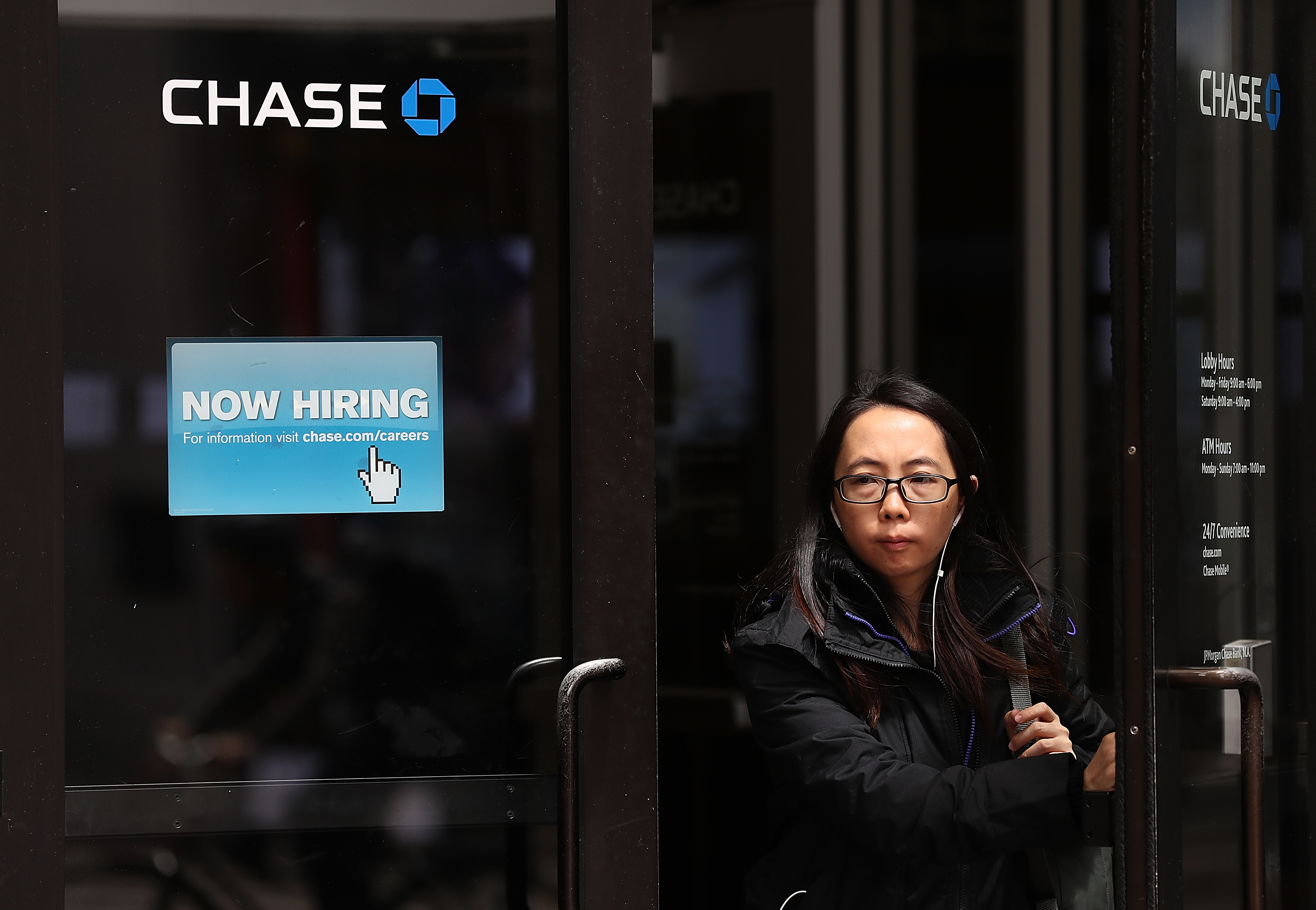 A 'now hiring' sign is posted outside of a Chase Bank office in San Francisco, California.