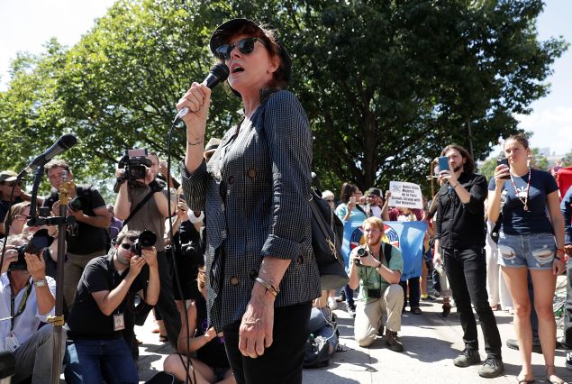 WASHINGTON, DC - AUGUST 24: Actress Susan Sarandon (C) speaks as actress Shailene Woodley (R) and comedian Lee Camp (2nd R) look on during a rally on Dakota Access Pipeline August 24, 2016 outside U.S. District Court in Washington, DC
