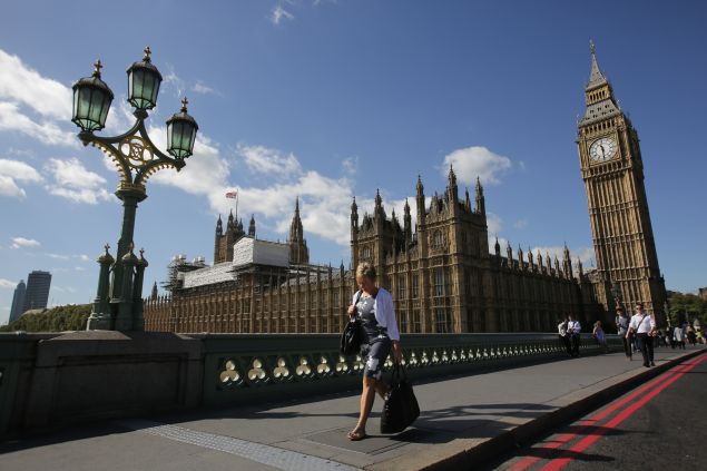 Scaffolding is seen on top of the Palace of Westminster which houses the Houses of Parliament in central London on September 8, 2016. Britain's lawmakers should move out of London's iconic Houses of Parliament for six years while the crumbling building is renovated to avert a crisis, a parliamentary report said on September 8. Behind its neo-Gothic facades topped by the world-famous Big Ben tower, the mother of parliaments has been eroded by air pollution and is overrun with mice, prompting warnings that it may have to be permanently abandoned unless urgent renovations are carried out.