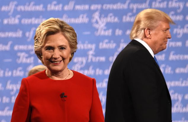 Democratic nominee Hillary Clinton (L) and Republican nominee Donald Trump leave the stage after the first presidential debate at Hofstra University in Hempstead, New York on September 26, 2016. 