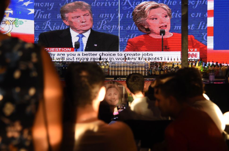Clinton supporters watch the first US presidential debate between Democratic candidate Hillary Clinton and Republican Donald Trump, at a debate watch party.