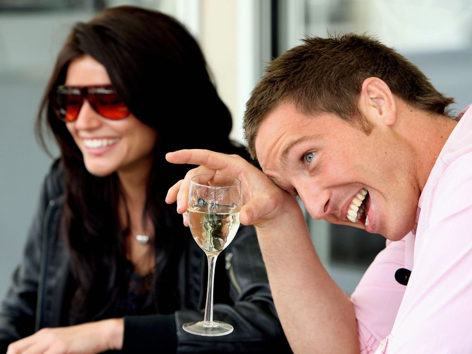 Paul Bardetta (R) of Sydney, laughs as he talks with his celebrity date and local television host Brooke Sheehan (L), during an online dating promotion by Australia's only live, mobile dating website "Partner4Real", in Sydney, 17 September 2007. Over the next week Bardetta will date 20 women at his portable house on Circular Quay in Sydney, selecting one to take to Paris with him as a prize. AFP PHOTO/Greg WOOD