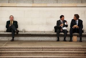 LONDON, ENGLAND - AUGUST 12: Businessmen take a lunch break in London's financial district on August 12, 2009 in London, England. The Financial Services Authority have today outlined new rules on how financial institutions should determine pay and bonuses for their staff. The guidelines aim to avert the current problems in the financial sector by linking compensation far more closely with the long-term profitability.