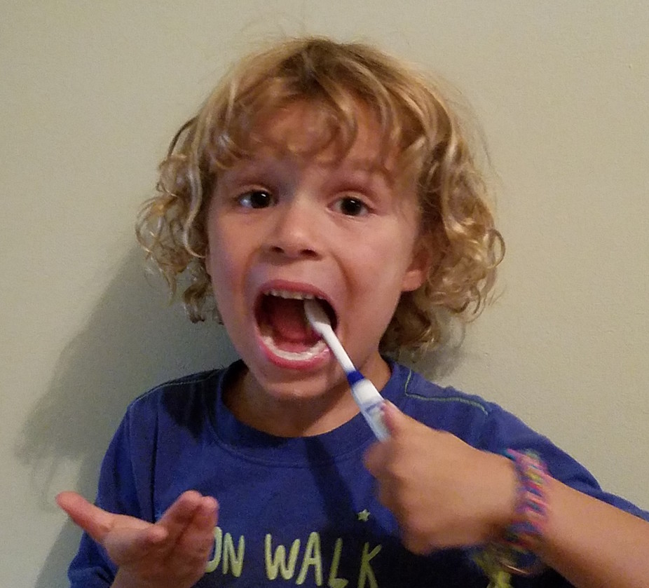 The author’s son, brushing his teeth for the camera.
