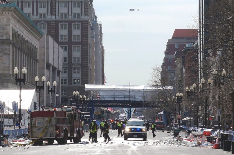 Emergency personnel at work at the Boston Marathon bombing site.