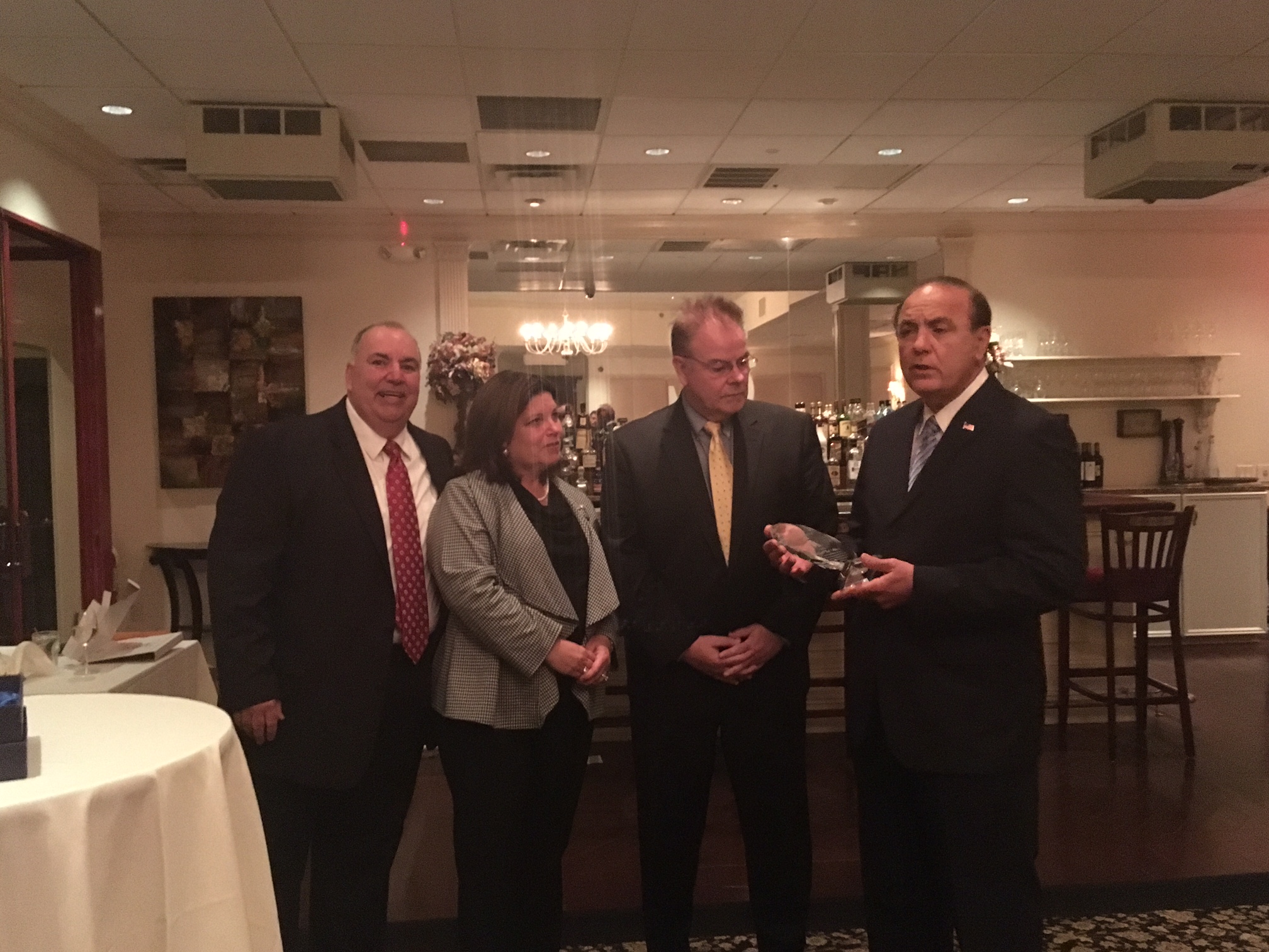 Paul DiGaetano (right) presents Pat Schuber with a leadership award.