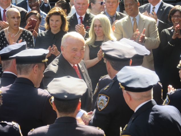 Outgoing Police Commissioner Bill Bratton greets officers during a processional marking his last day as commissioner. 