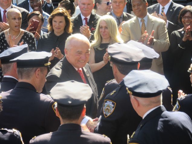 Outgoing Police Commissioner Bill Bratton greets officers during a processional marking his last day as commissioner.