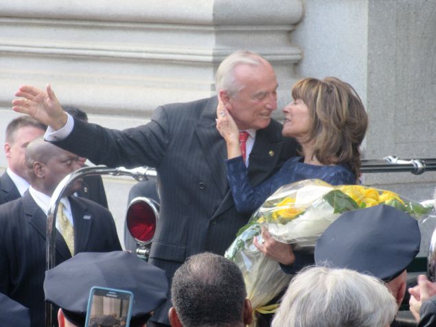 Outgoing Police Commissioner Bill Bratton embraces his wife as he waves goodbye to the crowd on his last day as the city's top cop.