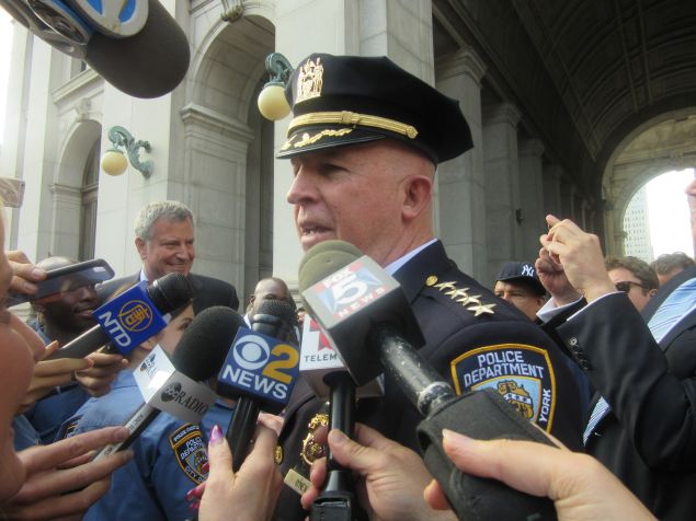 The city's new top cop, Police Commissioner James O'Neill, addresses reporters following the processional.